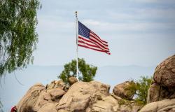 Photo by Get Lost Mike: https://www.pexels.com/photo/a-flag-on-a-rock-formation-9012267/